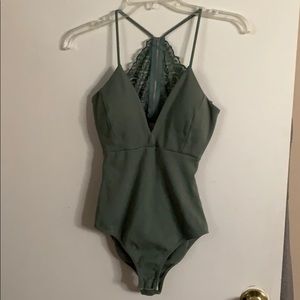 Green lace back body suit